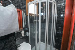 a bathroom with a shower with a toilet and a sink at Tbilisi My House in Tbilisi City +53 photos