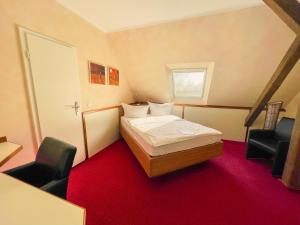 En eller flere senge i et værelse på Akzent Hotel Saltenhof