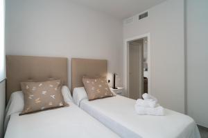 Posteľ alebo postele v izbe v ubytovaní AAC Málaga - Apartamento con terraza, muy amplio, totalmente equipado, cerca del centro y nuevo!