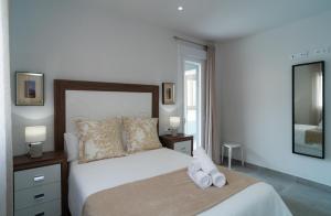 Posteľ alebo postele v izbe v ubytovaní AAC Málaga - Apartamento con terraza, muy amplio, totalmente equipado, cerca del centro y nuevo!