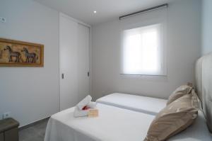 Posteľ alebo postele v izbe v ubytovaní AAC Málaga - Apartamento con terraza, muy amplio, totalmente equipado, cerca del centro y nuevo!