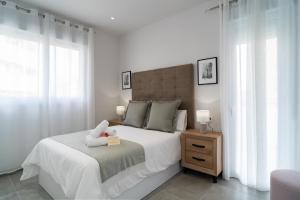 Posteľ alebo postele v izbe v ubytovaní AAC Málaga - Apartamento con terraza, muy amplio, totalmente equipado, cerca del centro y nuevo!