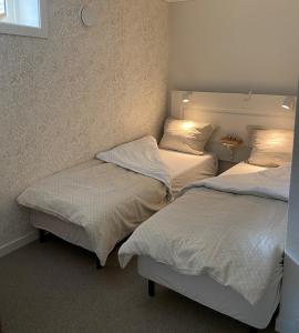 מיטה או מיטות בחדר ב-Idyllisk sørlandshus