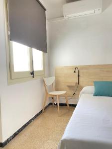 Postel nebo postele na pokoji v ubytování Atico con Terraza