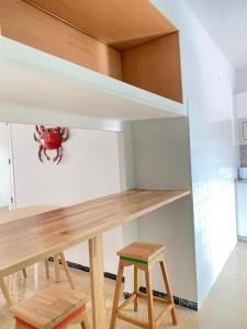 Kuchyň nebo kuchyňský kout v ubytování Atico con Terraza