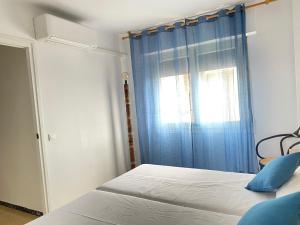 Postel nebo postele na pokoji v ubytování Atico con Terraza