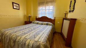 Postel nebo postele na pokoji v ubytování LA PARRA - Casa Rural en el Valle del Jerte + 2 fotografie