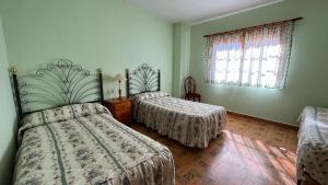 Postel nebo postele na pokoji v ubytování LA PARRA - Casa Rural en el Valle del Jerte