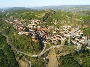 an aerial view of a small town on a mountain at Tania's Home Langhe in Feisoglio