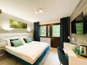 Ένα ή περισσότερα κρεβάτια σε δωμάτιο στο Beach Hotel Santalahti +111 φωτογραφίες