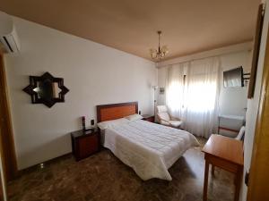 A bed or beds in a room at Hotel Bon Lloc