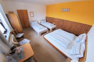 Postel nebo postele na pokoji v ubytování Haus Tapestry