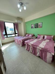 Postel nebo postele na pokoji v ubytování Lo-ReMi Homestay + 3 fotografie