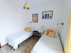 Posteľ alebo postele v izbe v ubytovaní Hawaii Fira Barcelona