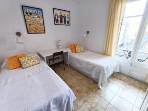 Posteľ alebo postele v izbe v ubytovaní Hawaii Fira Barcelona