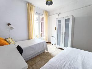 Posteľ alebo postele v izbe v ubytovaní Hawaii Fira Barcelona