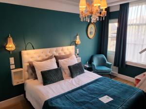 Postel nebo postele na pokoji v ubytování Boutique Hotel Huys van Leyden
