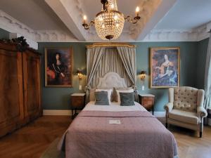 Postel nebo postele na pokoji v ubytování Boutique Hotel Huys van Leyden