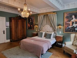 Postel nebo postele na pokoji v ubytování Boutique Hotel Huys van Leyden