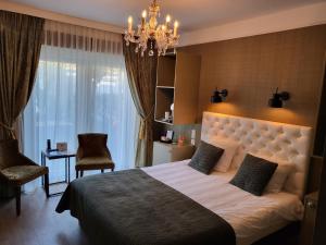 Postel nebo postele na pokoji v ubytování Boutique Hotel Huys van Leyden