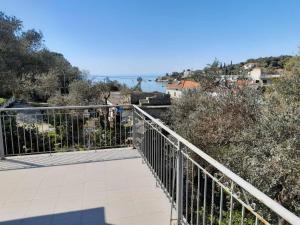 a balcony with a view of a body of water at HORTO HOUSE in Chorto