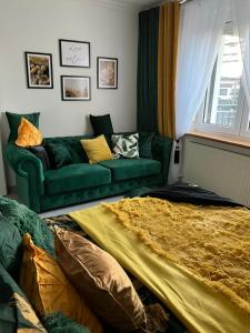 A seating area at Comfort Zone Ostróda Villa Apartment B