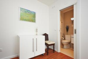 a bathroom with a toilet and a white cabinet at Villa Lunae - Sintra Flats in Sintra +67 photos