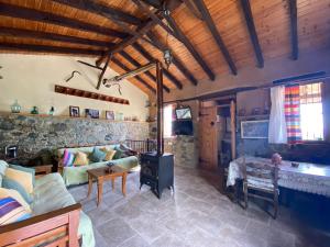 a living room with a couch and a table at Rodous Village House in Limassol