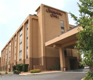 a building with a sign on the front of it at Hampton Inn Morgantown in Morgantown