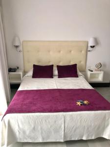 Postel nebo postele na pokoji v ubytování Hotel Océano Centro