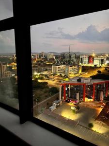 a view of a city from a window at iTowers luxurious 1-Bedroom apartment- 15th Floor in Gaborone