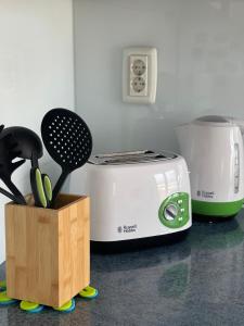a kitchen counter with a toaster and a knife block at Apartment Trogir City in Trogir