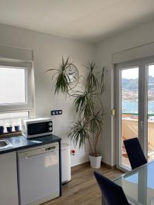 a kitchen with a sink and a counter top at Apartment Trogir City in Trogir