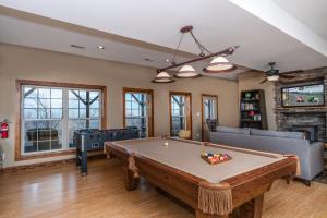 a living room with a pool table at Heaven's Peak in Banner Elk