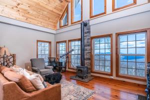 a living room with a couch and a fireplace at Heaven's Peak in Banner Elk
