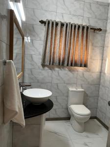 a bathroom with a toilet and a sink at Western Ocean Breeze Self Catering in Victoria