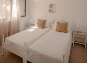 Postel nebo postele na pokoji v ubytování Viviendas Ferrer - Formentera Break