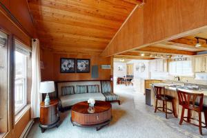 a living room with a couch and a table at Cozy on the Coast in Seaside