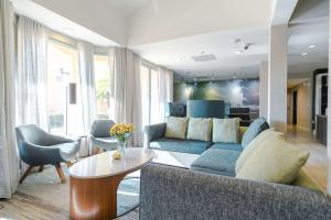 a living room with a couch and a table at Sonesta Select Camarillo in Camarillo