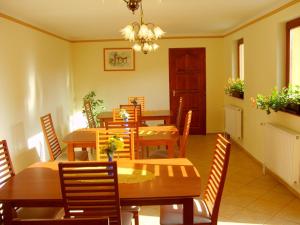 a dining room with a table and chairs at Szűts Vendégház in Fertőrákos