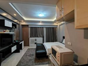 TV a/nebo společenská místnost v ubytování palm tree villas