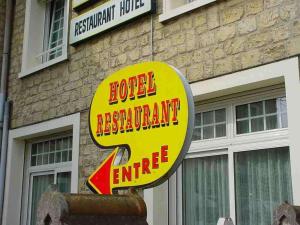 a sign for a hotel restaurant with the number two at Le Clos Normand in Troarn