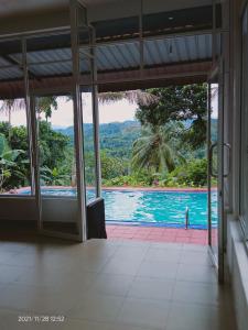 a view of a swimming pool from a house at Discovery resort in Ratnapura