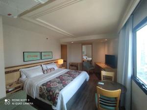 Cama o camas de una habitación en Suíte alto-padrão LETs IDEA