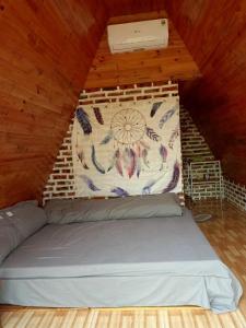 a room with a bed in a attic at Homestay Bình Huy in Mộc Châu