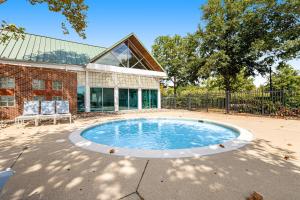 a circular pool in front of a building at Bear Trap Dunes --- 79C October Glory Ave in Ocean View