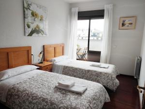 A bed or beds in a room at DÚPLEX SANABRIA