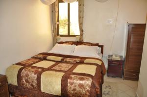 Postel nebo postele na pokoji v ubytování Rich Hotel + 26 fotografií