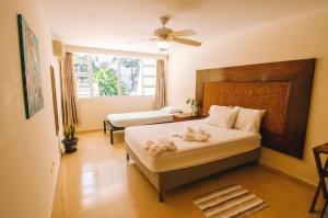Ein Bett oder Betten in einem Zimmer der Unterkunft Bodhi Panama City