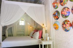 Postel nebo postele na pokoji v ubytování Chanteak Bali - Teak House 2